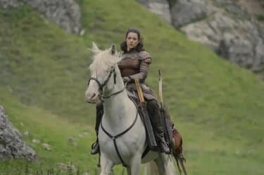 Lady Royce on horseback in the hills of the Vale.