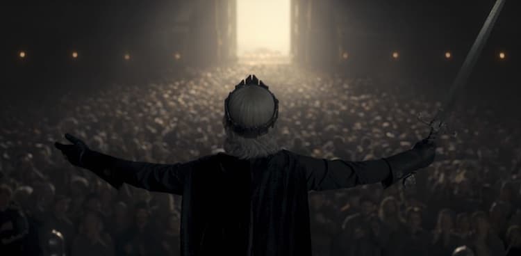 Aegon opens his arms wide to the crowd's applause.
