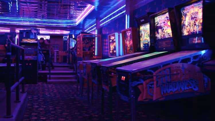 A fully functioning arcade as Ellie and Riley play on a cabinet in the background