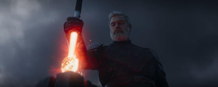 Baylen Skoll plunges his red lightsaber into the star map orb, destroying it