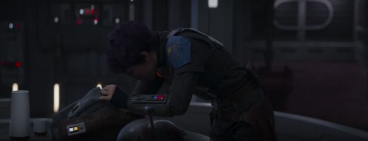 Sabine searches her bag for a lost item