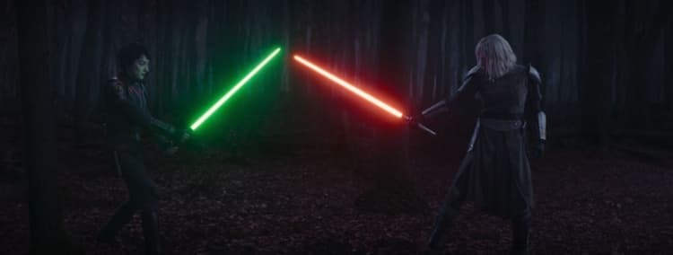 Sabine, left, holds her green lightsaber in defense of Shin’s red lightsaber, right of screen