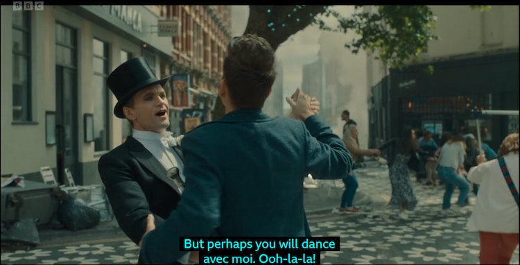 The Toymaker Dances with the Doctor in a top cat and a suit