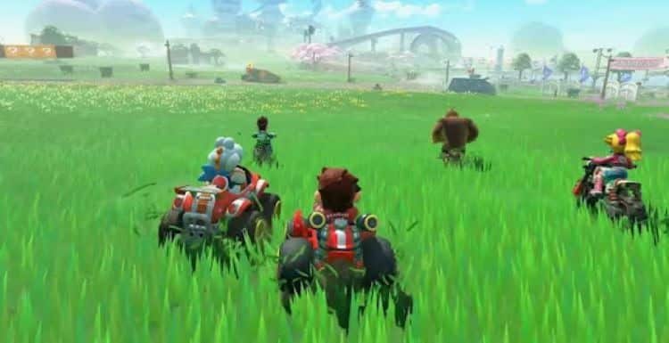 Mario, Luigi, Yoshi, Peach, and Donkey Kong are driving across a grassy field. A car and a bridge are in front of them. Trees can be seen in the distance.